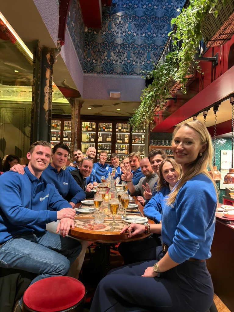 ChannelDock team dinner around a long restaurant table